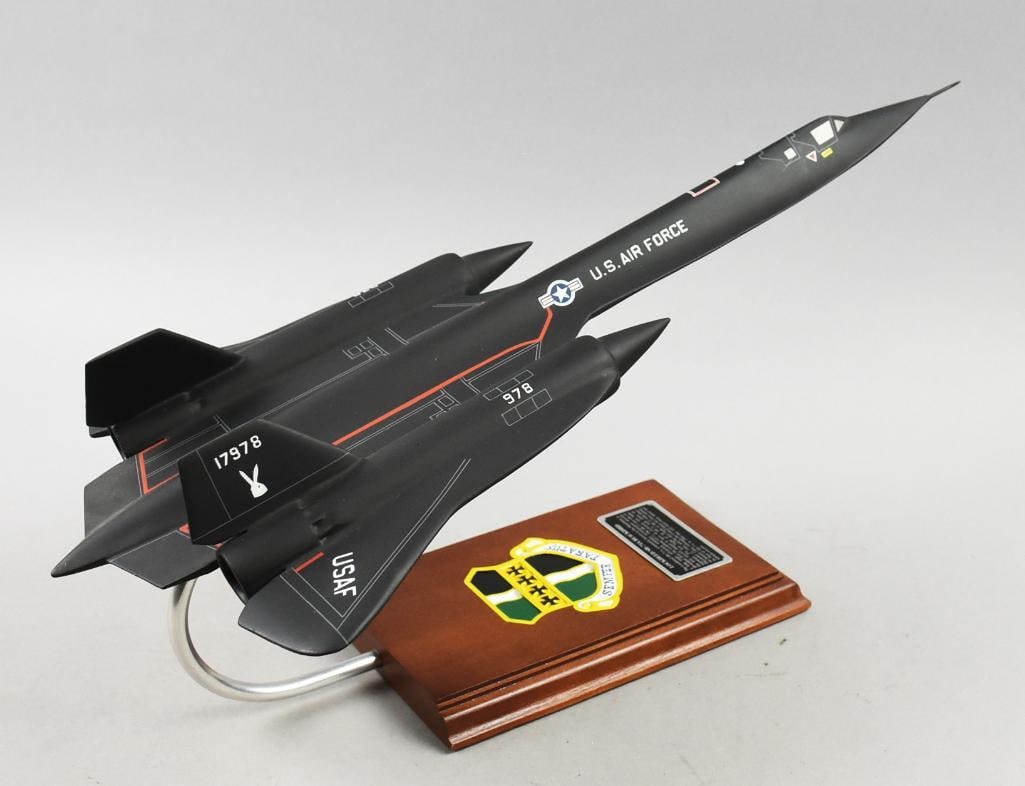 Lockheed SR-71A Blackbird Desktop Model: Fun desktop model from Lockheed Marin. Per the wood base, it is an SR-71A, a United States Air Force plane known as Blackbird. Measures approx. 21" x 11" x 9.5" tall.