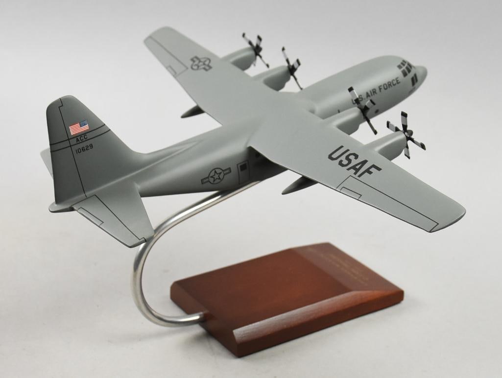 Lockheed Martin C-130H Hercules Desktop Model: Very cool scale airplane for Lockheed Martin. Per the wooden base, this desktop model is a C-130H Hercules 1/100 scale. Model is for a United States Air Force. Overall approx measures 15" x 12" x 7" t