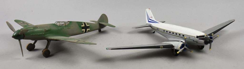 2 Fun Plane Models, 1 ERTL: 2 model airplanes, 1 is a metal ERTL model Kerr-Mcgee and the green one is unmarked but made of tin. Green one measures 12" x 13", white one measures 11" x 15".