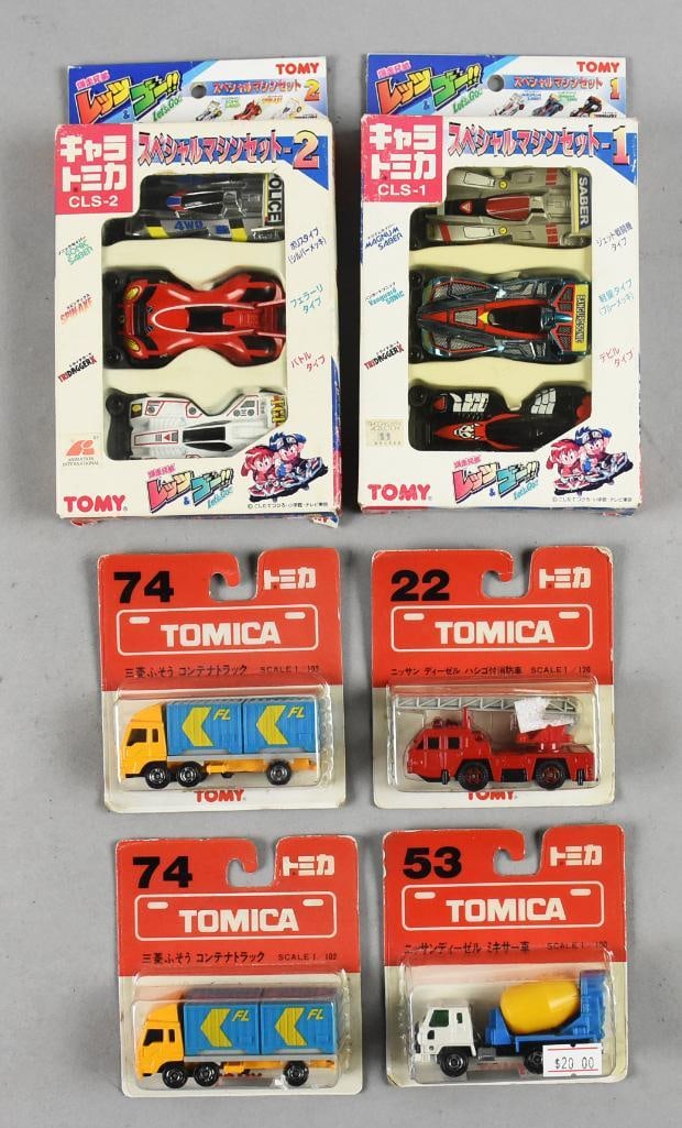 (6) Vintage Japanese Tomy/Tomica Die Cast Cars-MOC-NOS: Lot is for six Vintage Japanese Tomy/Tomica Die Cast Cars-MOC-NOS. Includes two Special Machine three car sets, two Mitsubishi Container Trucks, Nissan Fire Engine and Nissan Cement Mixers. From the h