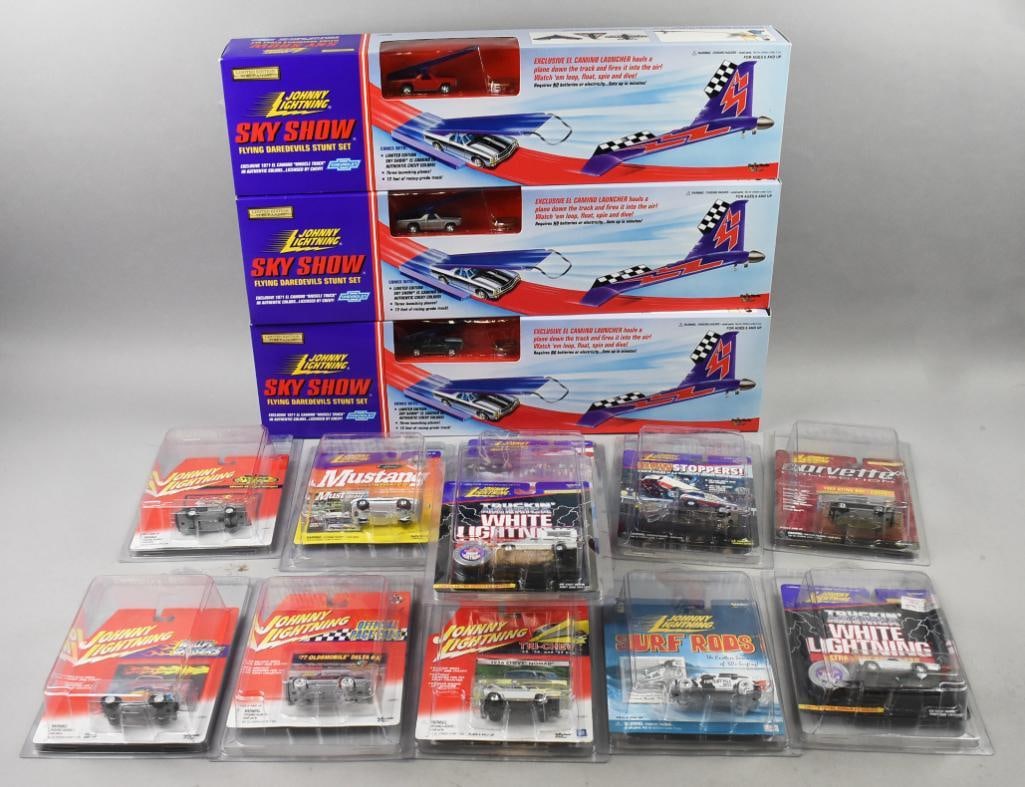 (14) 1995, 97, 99, 2000-01 Johnny Lightning Assortment-NOS: Lot is 14 1995, 97, 99, 2000-01 Johnny Lightning Assortment-NOS. Includes as follows: photo with 3 sky shows all 1995, photo with show stoppers all 1999. Photo with tri chevy all 2001, photo with surf