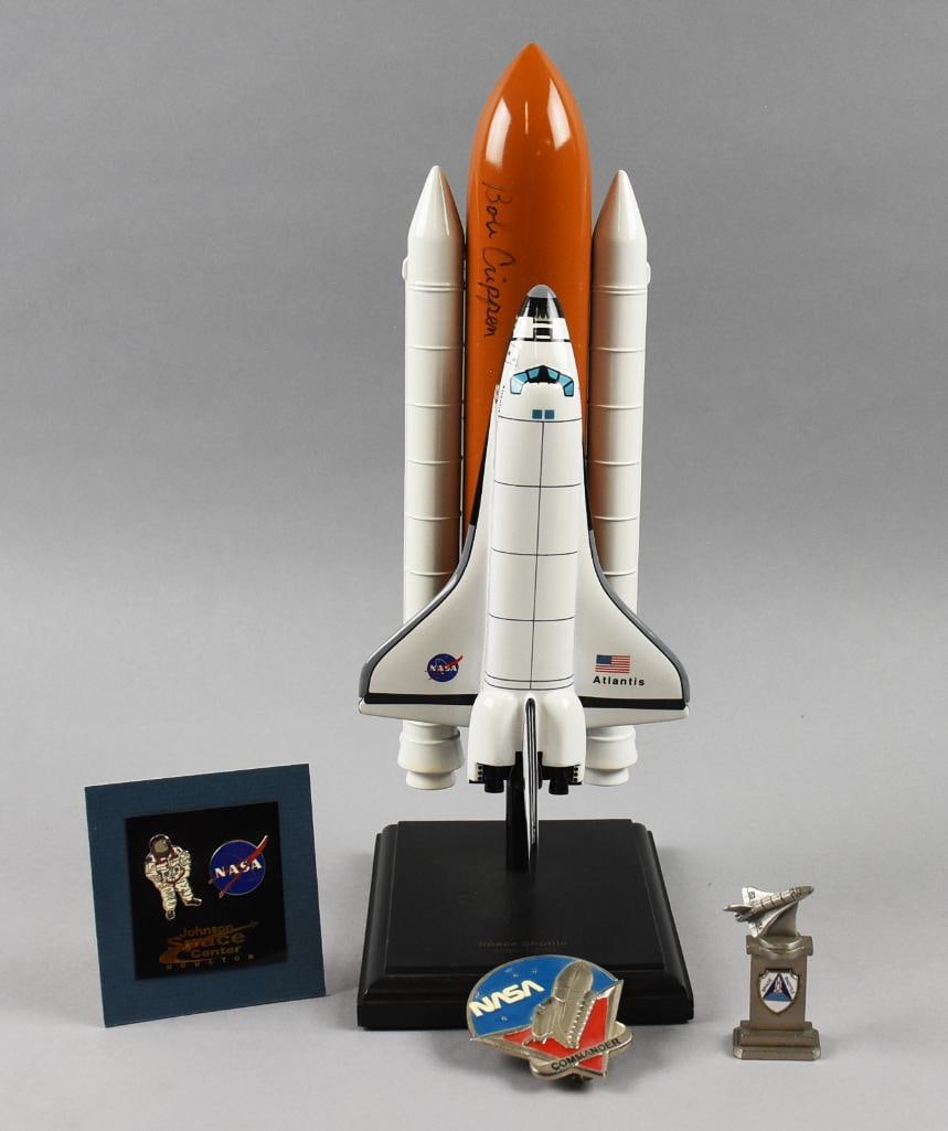 Bob Crippen Signed NASA Space Shuttle, Pins & Paperweight: This great selection of NASA memorabilia starts with a Space Shuttle Atlantis signed by astronaut Bob (Robert) Crippen (b1937). Shuttle manufactured by Toys & Models Corporation, a pewter shuttle pape