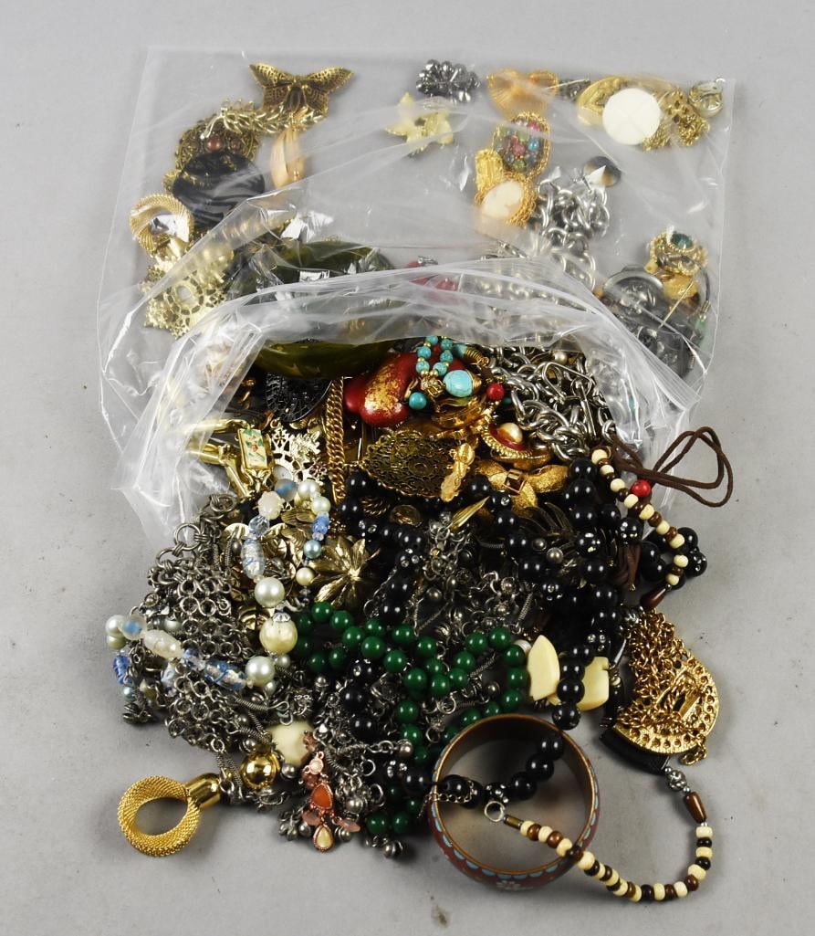 Over 4 Lbs Misc. Unsorted Vintage Costume Jewelry: Lot is 4.24 lbs of misc assorted costume jewelry. Lot is virtually unsorted, but some pieces spread out for photos. Has pretty rhinestones and one bracelet appears bakelite, but not tested.