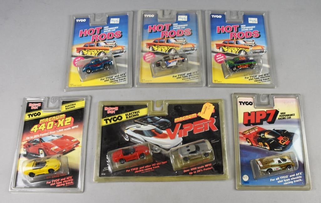 (6) 1990, 94-95 Tyco Slot Cars Hot Rods and More - MIP-NOS: Lot is six 1990, 94-95 Tyco Hot Rods and More - MIP-NOS. Includes an HP7, Magnum 440-X2, Viper double pack and three Hot Rods: Ford Coupe, Corvette and Chevy. Single owner collection from the largest