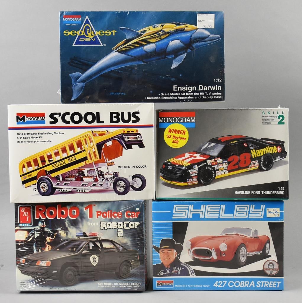 (5) 1973, 89-91, 94 Monogram/AMT CAR Model Kits-MIB-NOS: Lot is five 1973, 89-91, 94 Monogram/AMT Model Kits-MIB-NOS. Includes Ensign Darwin, S'cool Bus, Havoline Ford Thunderbird, Robo 1 Police Car and Shelby Cobra. Single owner collection from the largest