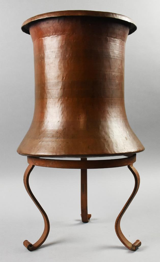 Egyptian Hand Wrought Copper Arts and Crafts Water Jug: This great piece is a Egyptian antique and appears hand hammered. Copper water jug that also appears to be hand brushed and carved with subtle details throughout. Comes on hand wrought tripod stand th