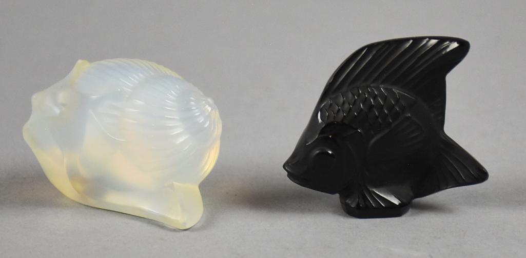 Lalique Opalescent Snail and Black Fish Paperweights: These are a pair of cute paperweights from Lalique. One is in the form of a snail in opalescent crystal and one is a fish in black crystal. Both are approx. 2" x 2".