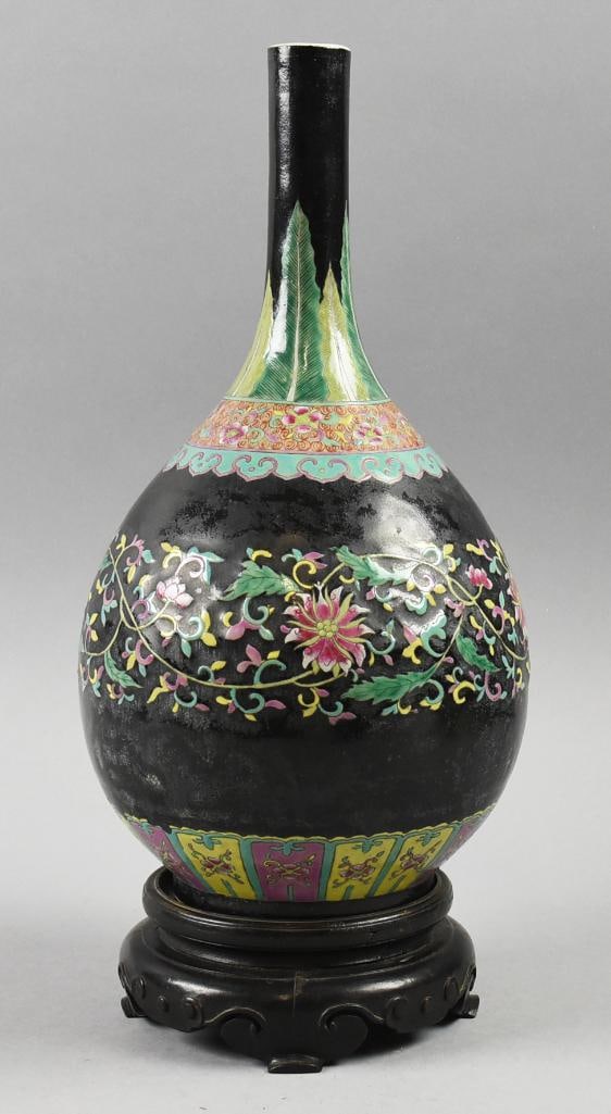 Antique Chinese Yixing Enamel Bottle Vase w/ Stand: Gorgeous antique vase from China. It appears to be Yixing clay with black enamel, green feathers around neck, accented with pink flowers around the shoulder and small yellow and pink panels at the bas