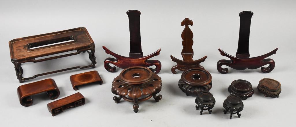 Vintage/Antique Chinese Rosewood Display Stands: All of these pretty pieces are stands originating in China. Each piece appears to be carved in rosewood. Pieces fit vases and plates as stands for figurines. From the estate of Dr. Jemima H.Hayne (189