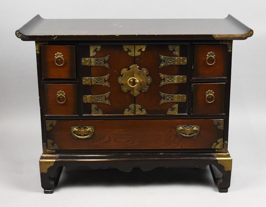 Vintage Korean Apothecary Cabinet, Brass Hardware: Lovely apothecary cabinet appears to be of Korean origin. Solid wood, center cupboard with two small drawers on either side and one long drawer below. All hardware appears to be brass. 21.5" tall x 13