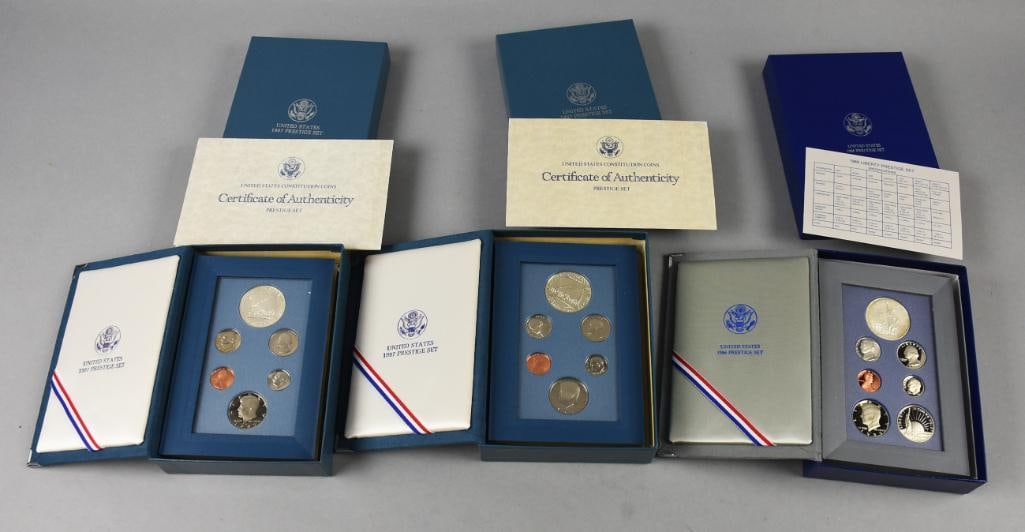 1986-1987 US Mint Constitution-Liberty 90% Silver-COAs: 1986-1987 US Mint Constitution-Liberty Prestige, Mint-COAs. Liberty Prestige with a 90% silver silver dollar, Constitution are 900 fine.