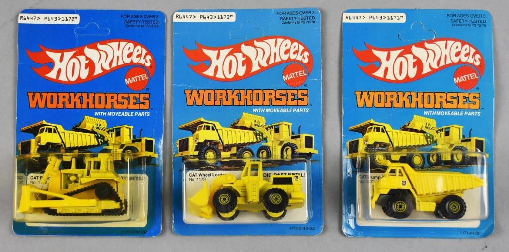 (3) 1979-80 Mattel Hot Wheels Workhorses-MOC-NOS: Lot is three 1979-80 Mattel Hot Wheels Workhorses-MOC-NOS. Includes CAT Wheel Loader, CAT Dump Truck and CAT Bulldozer. Single owner collection from the largest toy collector on the west coast.