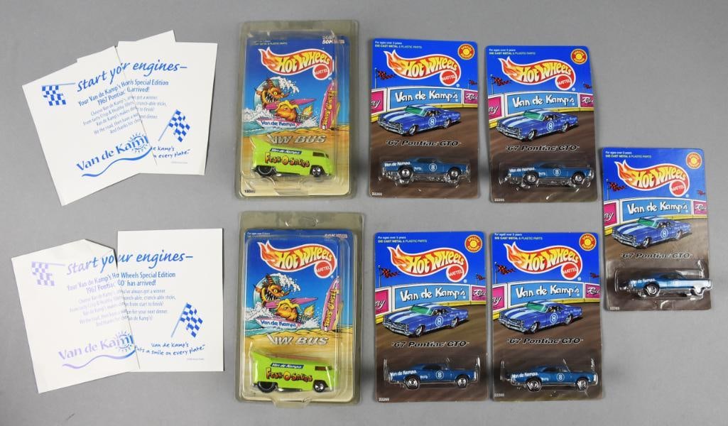 (7) 1997-98 Mattel Hot Wheels Van De Kamps Adverts-MOC-NOS: Lot is seven 1997-98 Mattel Hot Wheels Van De Kamps Adverts-MOC-NOS. Includes two VW Bus and five '67 Pontiac GTO. Single owner collection from the largest toy collector on the West Coast.