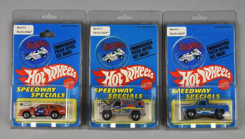 (3) 1977 Mattel Hot Wheels Speedway Specials-Unpunched-NOS: Lot is three 1977 Mattel Hot Wheels Speedway Specials-Unpunched-NOS. Includes Flat Out on punched card and Bywayman and Baja Breaker, both on unpunched cards. Single owner collection from the largest 