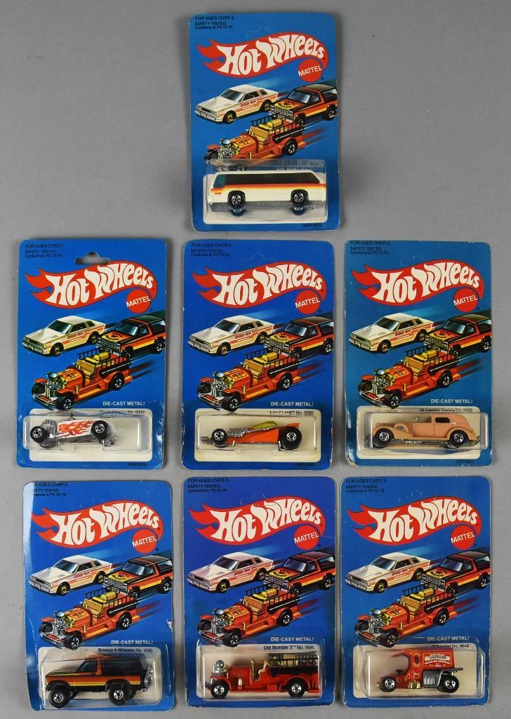 (7) 1981 Mattel Hot Wheels Die Cast-Unpunched-MOC-NOS: Lot is seven 1981 Mattel Hot Wheels Die Cast-Unpunched-MOC-NOS. Includes Bronco 4 Wheeler, Rapid Transit, Street Rodder, Land Lord, Classic Caddy, Old Number 5 and T-Totaller. Single owner collection