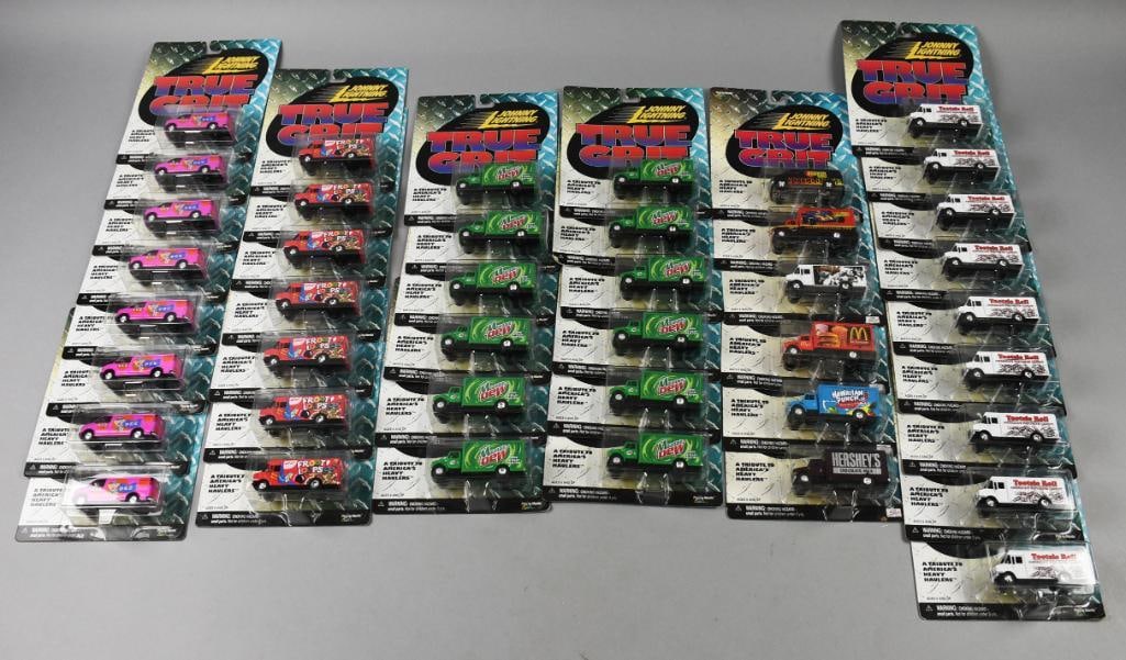 (42) 2000 Johnny Lightning True Grit Heavy Haulers-MOC-NOS: Lot is 42 2000 Johnny Lightning True Grit Heavy Haulers-MOC-NOS. Includes seven Fruit Loops, eight Pez, nine Tootsie Roll, 12 Mountaint Dew and six more assorted. Single owner collection from the larg