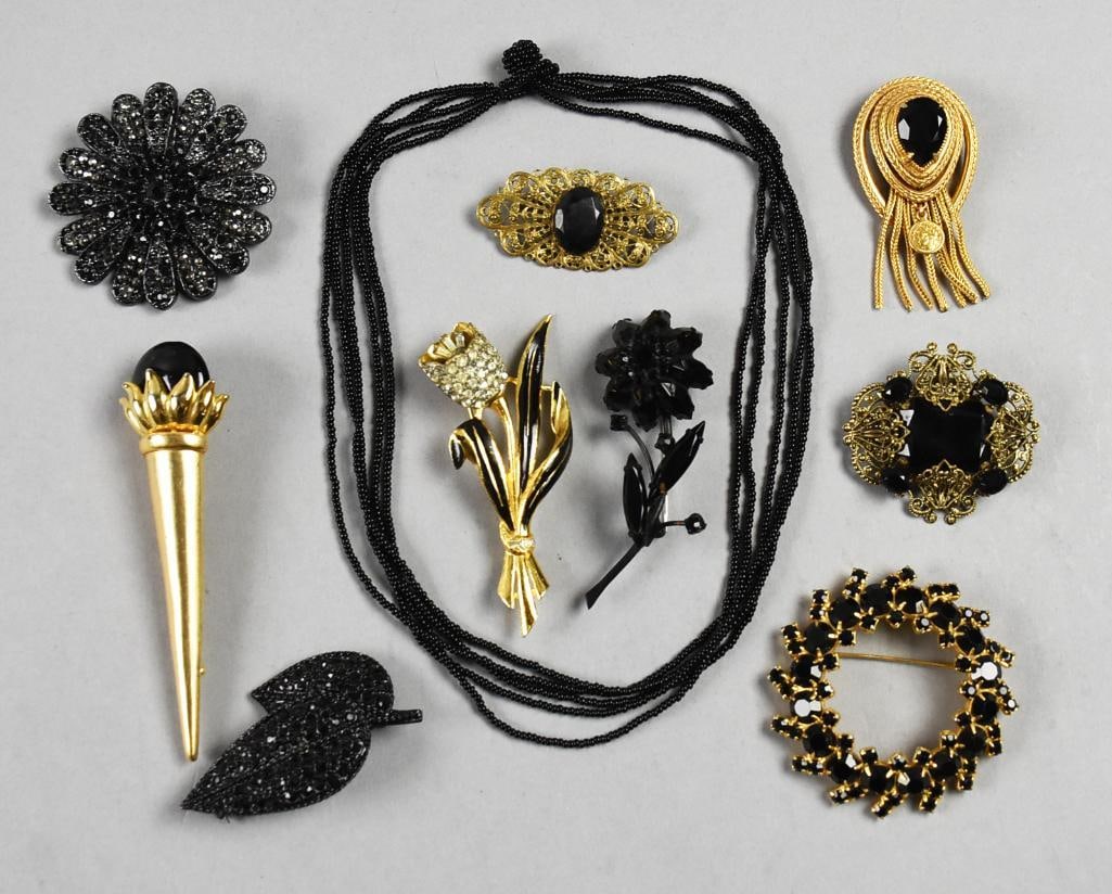 Vtg Black-Gold Tone Costume Jewelry, Florenza, Coro & More: This is a pretty collection of costume jewelry. One brooch/pendant is marked Florenza, Karl Lagerfeld style torch brooch, unsigned Coro Trembler single flower, Czech filligree, and more. Includes a mu