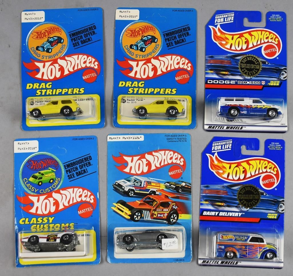 (6)1970s-90s Mattel Hot Wheels Die-Casts-MOC-NOS: Lot is six 1970s-90s Mattel Hot Wheels Die-Casts-MOC-NOS. Includes Dairy Delivery and Dodge Ram 1500, Science Friction, Stutz Blackhawk and two Packin' Pacer. Single owner collection from the largest 