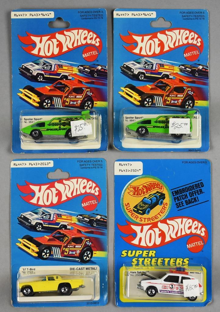 (4) 1977, 1979 Mattel Hot Wheels Die-Cast-MOC-NOS: 1970s. Includes '57 T-Bird 1979, Hare Splitter 1977, and two Spoiler Sport 1977. Hare Splitter is unpunched. Single owner collection from the largest toy collector on the West Coast.