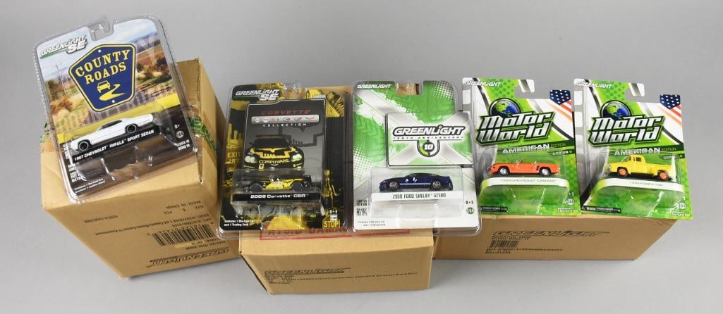 (3) 2000s Factory Cases Greenlight Die-Cast-MOC-NOS: Lot is 3 2000s Factory Cases Greenlight Die-Cast-MOC-NOS. Includes Includes Motor World Series, International Durastar and Country Roads Series. One carton with 12, two with six, 24 in total. Sin