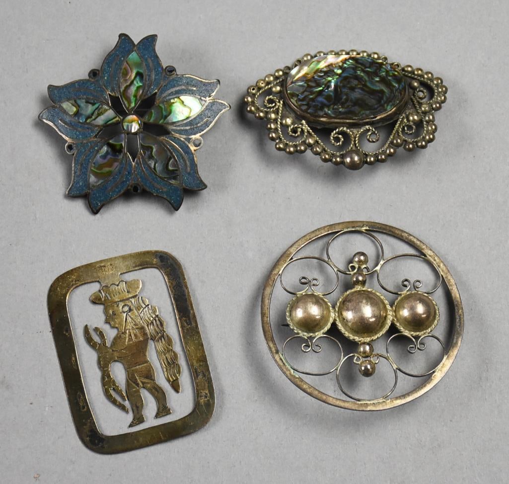 Vintage Assortment Mexican Sterling Brooches-Signed: This great lot of sterling jewelry is all of Mexican origin. Includes A. Garcia Taxco, abalone and what appears to be sodalite in the form of a flower, one appears to be marked EJD and is pierced with