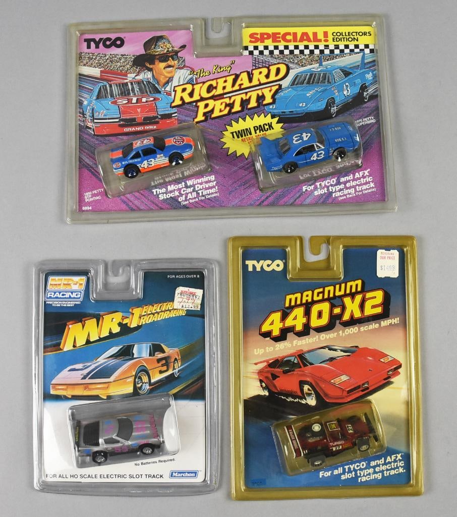(3) 1990-92 Tyco/Marchon Slot Cars-Richard Petty PLUS-MOC-NOS: Lot is three 1990-92 Tyco/Marchon Slot Cars-Richard Petty PLUS-MOC-NOS. Includes the two pack for Richard Petty, Magnum 440-X2 Hopper and Marchon MR-1. Single owner collection from the largest toy col