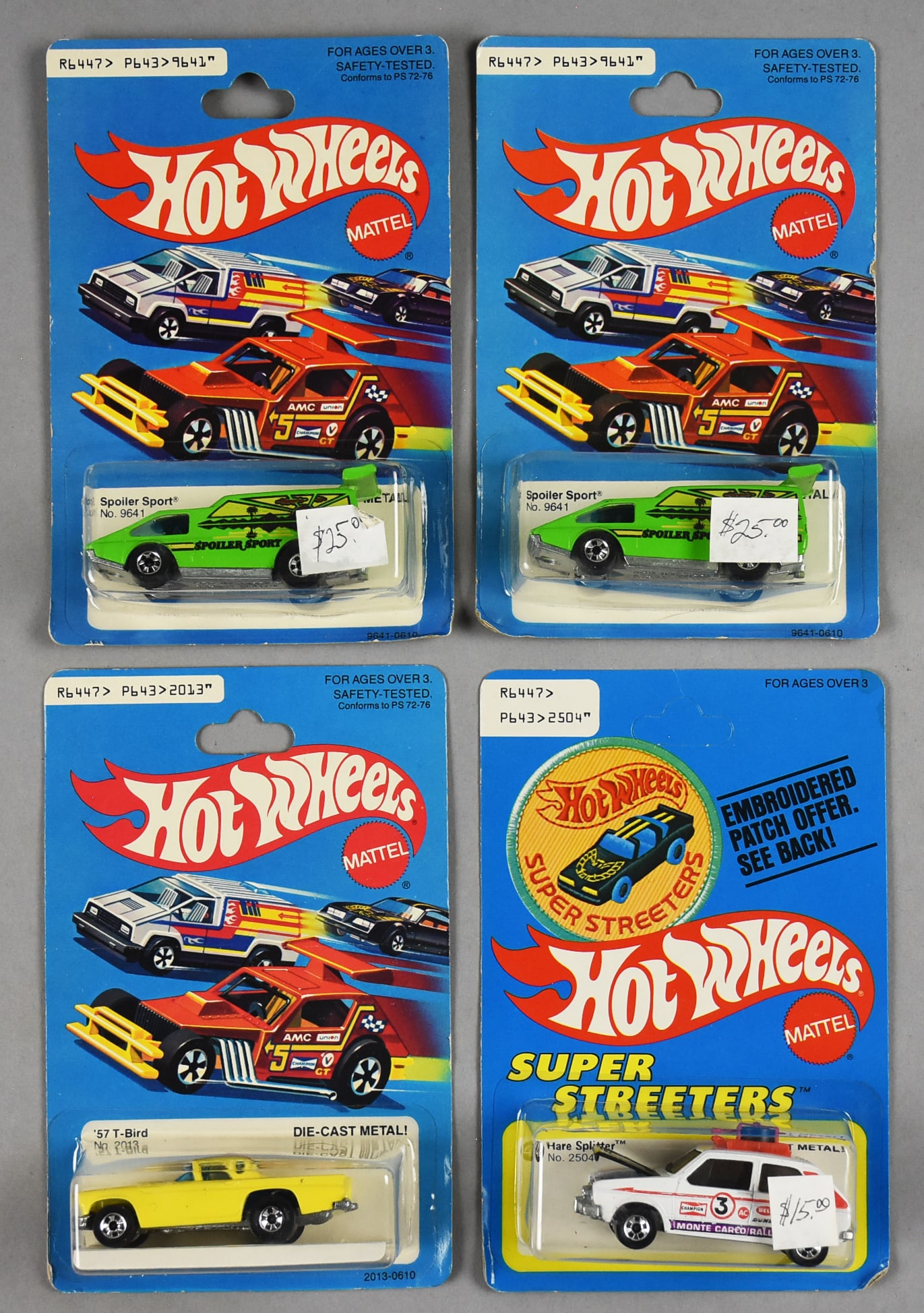 (4) 1977, 1979 Mattel Hot Wheels Die-Cast-MOC-NOS: 1970s. Includes '57 T-Bird 1979, Hare Splitter 1977, and two Spoiler Sport 1977. Hare Splitter is unpunched. Single owner collection from the largest toy collector on the West Coast.
