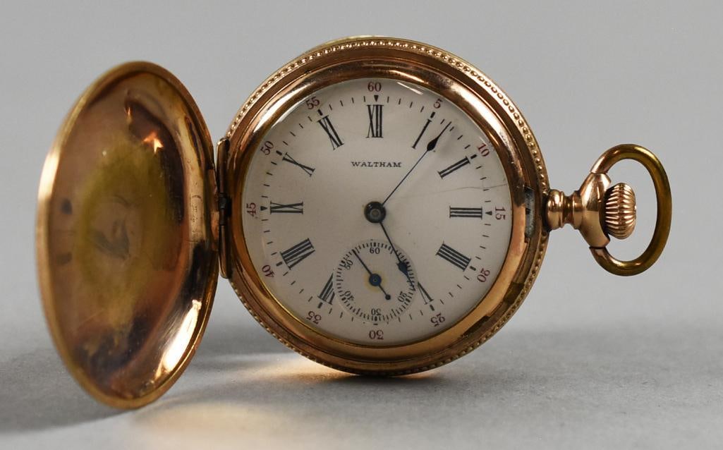 1900 Lady Waltham Pocket Watch, 14K Mascot Watch Case: This amazing antique pocket watch is a Lady Waltham in a 14K gold hunter case. Watch is in working condition, is 6s and 16 jewel. Pendant style, serial number 10097505 giving it a production year of 1