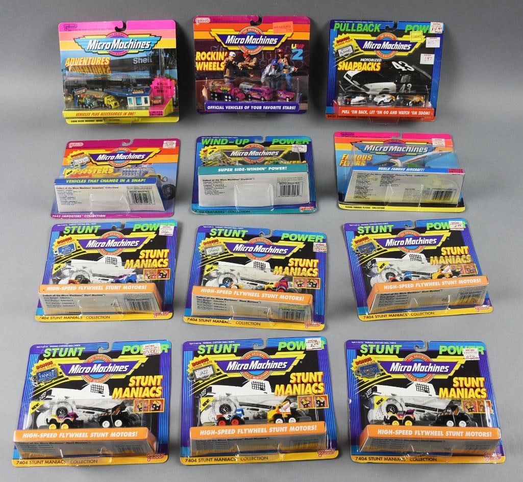 (12) 1990s Micro Machines Galoob Scale Miniatures-MIP-NOS: Lot is 12 1990s Galoob Micro Machines Scale Miniatures-MIP-NOS. Includes Stunt Maniacs, Imposters, Famous Flyers, Crankers, Rockin' Wheels, Snapbacks and Adventurers. Single owner collection from the 