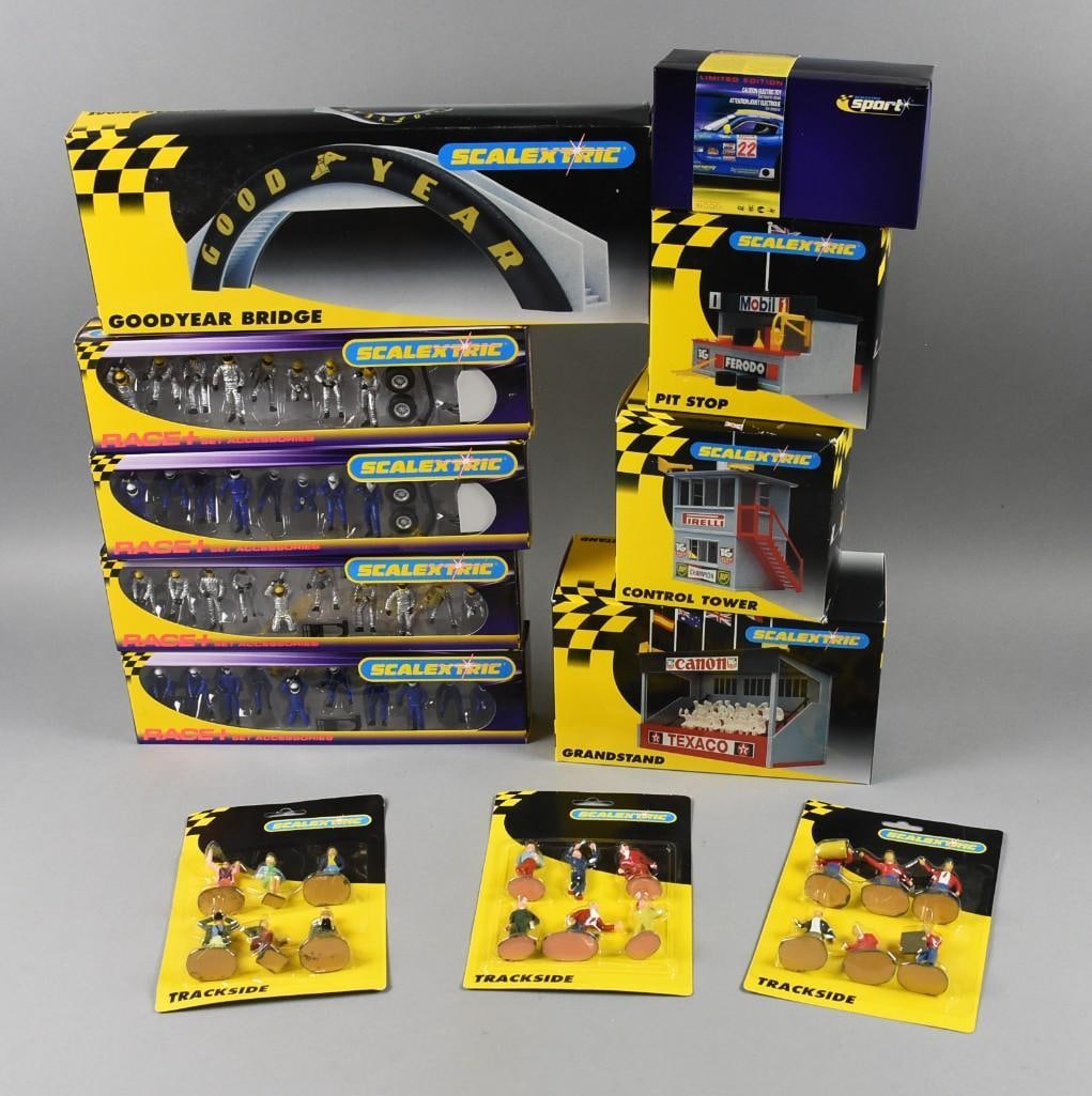 (12) Scalextric Buildings & People Accessories - MIP-NOS: Lot is 12 Scalextric Buildings & People Accessories - MIP-NOS. Includes Goodyear Bridge, Grandstand, Control Tower, Pitstop, Dodge Viper, three Trackside (variants) and four Pit Crew-two blue, two sil