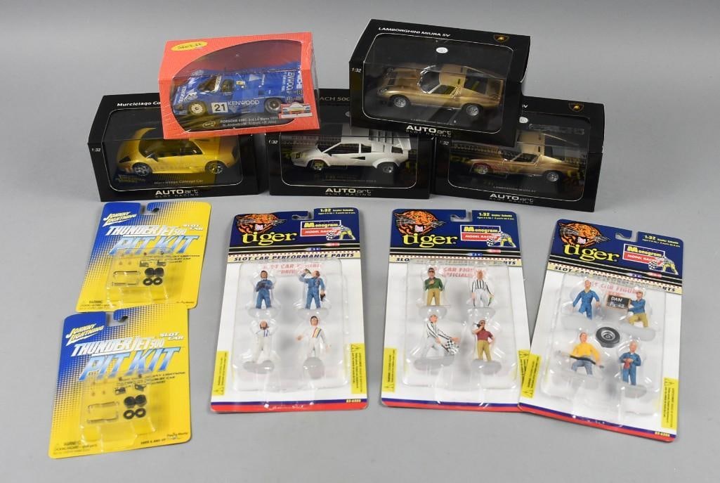 (10) 2000s Slot Cars Johnny Lightning, Tiger & More PLUS-NOS: Lot is 10 2000s Johnny Lightning, Tiger & More Slot Cars PLUS-NOS. Includes Auto Art Lamborghini (two duplicates), Slot It Porsche, Tiger Slot Car Figures and Johnny Lightning Pit Kits. Single owner c