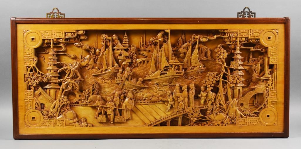 Antique Chinese Heavily Carved Relief Waterfront Scene: Heavily Carved Wooden Wall Panel – Waterfront Scene This intricately carved wooden panel features a detailed outdoor waterfront scene with numerous elements of activity. The composition includes peo