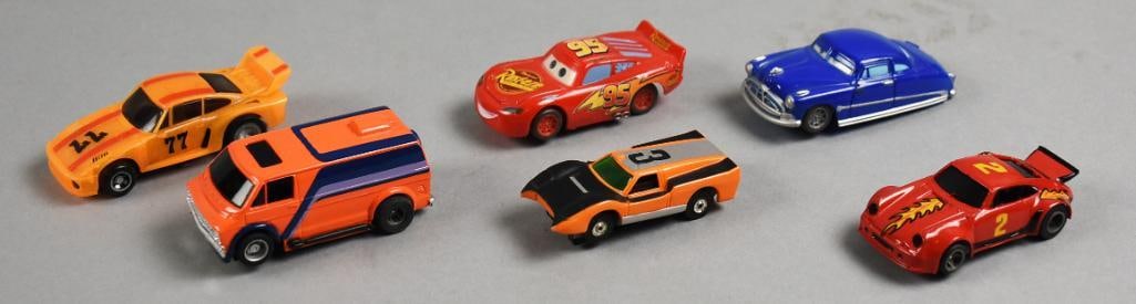 (6) Vintage Tyco, Aurora & More Slot Cars - Loose: Lot is six Vintage Tyco, Aurora & More Slot Cars - Loose. Includes Aurora ThunderJet, Tomy Porsche, Disney Pixar Hudson, Disney Pixar Rust-eze, Tyco Van and Tyco Porsche. Single owner collection from 
