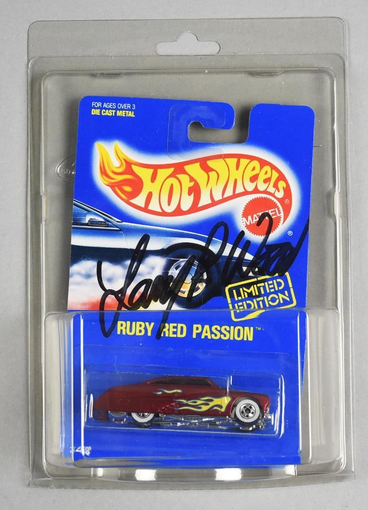 1991 Mattel Hot Wheels Larry Wood Signed Ruby Red Passion-NOS: Lot is a 1991 Limited Edition Mattel Hot Wheels Larry Wood Signed Ruby Red Passion-NOS. Single owner collection from the largest toy collector on the West Coast.