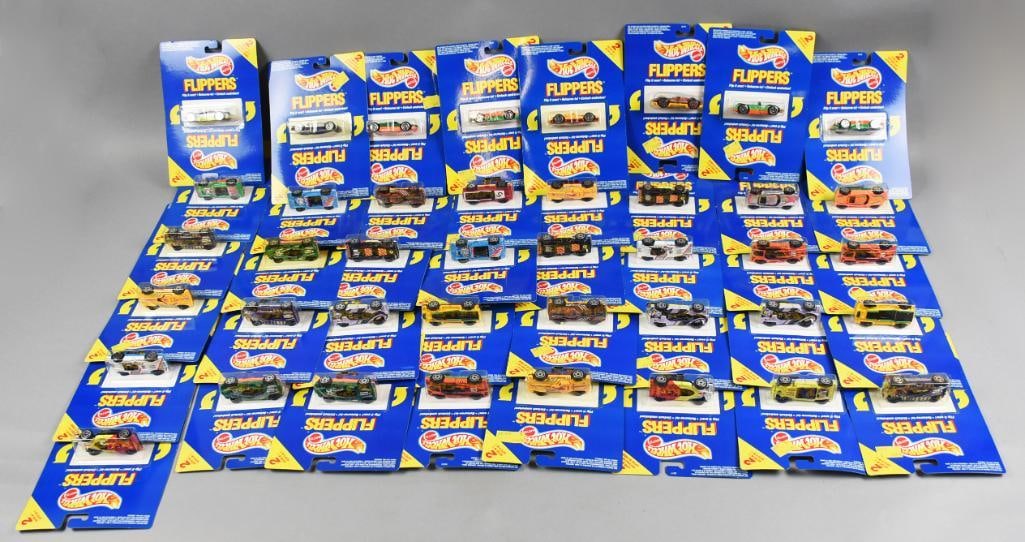 (41) 1989 Mattel Hot Wheels Flippers Die-Cast-MOC-NOS: Lot is 41 1989 Mattel Hot Wheels Flippers Die-Cast-MOC-NOS. Each pack is two cars in one. Lot with duplicates. Single owner collection from the largest toy collector on the West Coast.