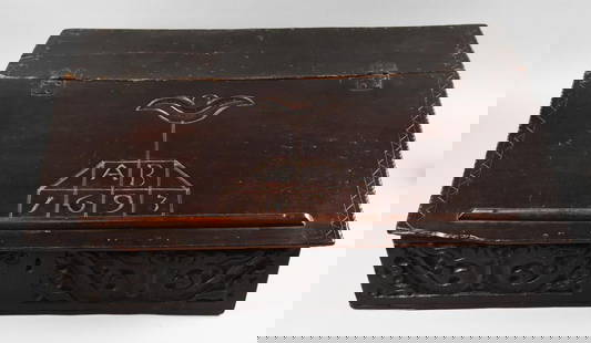 Late 17th Century Hand Crafted and Carved Bible Box: This is a spectacular bible box from the late 17th century. It is entirely hand crafted down to the hinges and nails. Slant top with a single carved flower, AB and the date 1693 and lock. Slant top