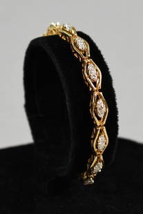 14K Yellow Gold & 1.25 CTTW Diamond Bracelet: 14K Yellow Gold Oval Link Diamond Tennis Bracelet – Approx. 1.25 cttw This exquisite tennis bracelet showcases timeless elegance with its classic design. Crafted in solid 14K yellow gold, the