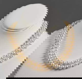 Double Strand 7mm Cultured Pearl Necklace & 14K White Gold Clasp: Stunning double strand of 7mm cultured pearl necklace with 14K white gold locking clasp. Pearls have a subtle pink undertone. Necklace measures approx. 14" long.