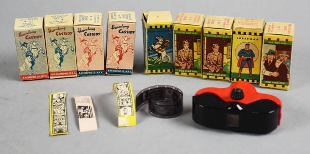 Vintage Acme Toy Corp Movie Viewer and Film Strips: Very cool vintage Acme Toy Corp red and black movie viewer in hard plastic. The 1999133 patent was filed in 1934 and granted in 1935. The viewer sets were released by Acme from 1940-66 with boxes of