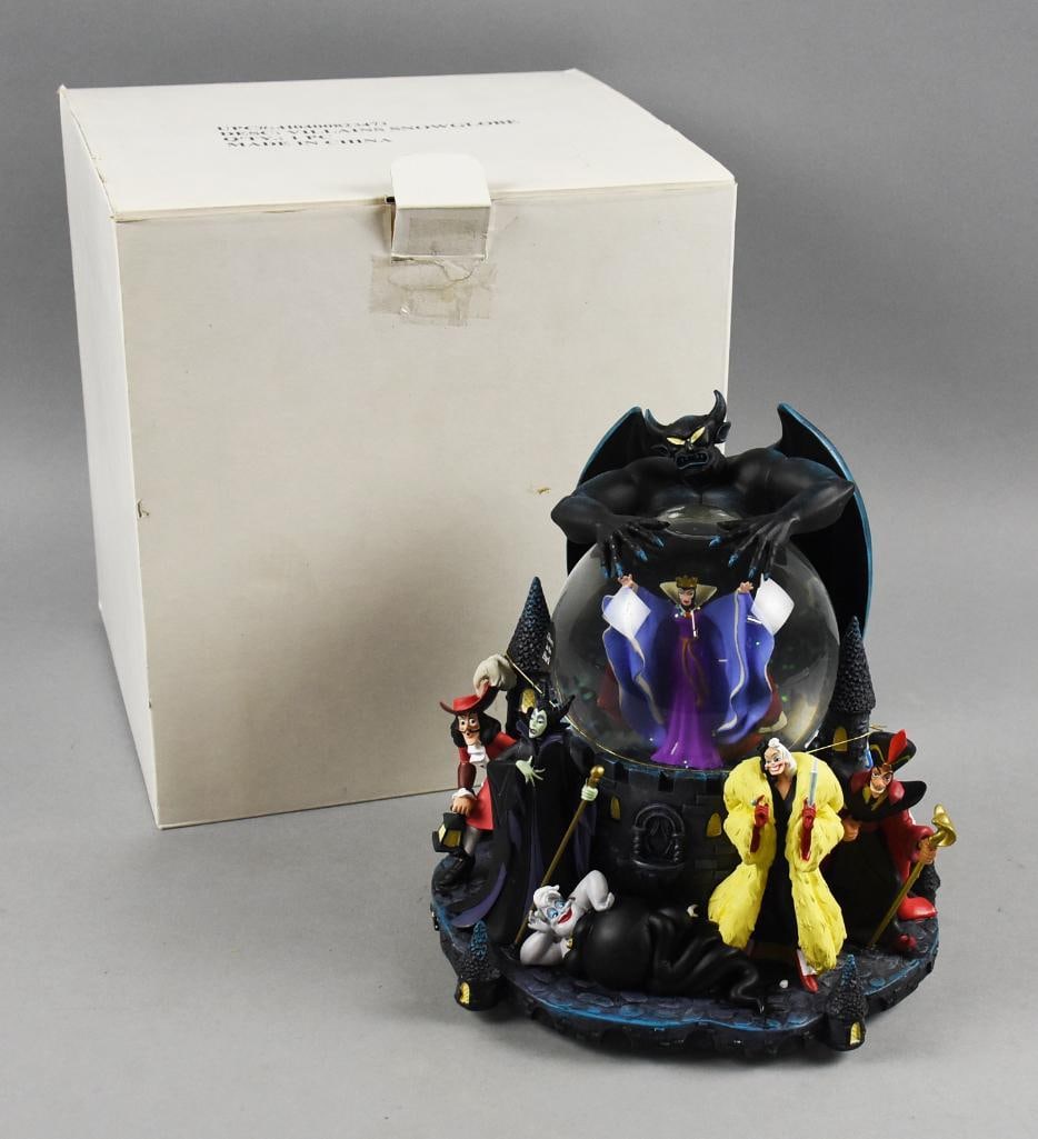 The Disney Store Villains Snowglobe - MIB - NOS: Very cute The Disney Store Villains Snowglobe - MIB - NOS. This showcases the most well known Disney villains including Cruela de Vil, Hook, Ursulla, Maleficent, Evil Queen and Chernaborg. The tune th