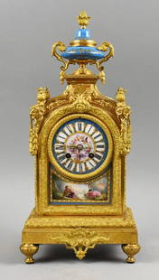 Japy Freres & Cie Louis XIV Style Gilt Bronze Porcelain Sevres Clock: Exquisite 19th century (1850-1890) mantle clock in the Sevres and Louis XIV styles. Movement is by renowned French clockmaking firm, Japy Freres & Cie. Top of the clock is a hand painted blue with