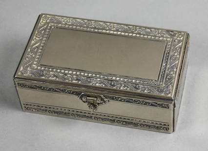 Vintage Silver Plated Locking Floral Jewelry Box: Very pretty vintage jewelry box in silver plate. Embossed ribbon and flower motif, lined in deep blue velvet. No visible markings and measures approx. 2.5" tall x 4" x 7".