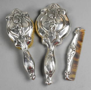 c1895 Art Nouveau Simpson, Hall & Miller Sterling Dresser Set: Fantastic dresser set from Simpson, Hall and Miller Co (1895-1898). All pieces, comb, mirror and hair brush have repousse cherubs holding floral vines, each framed by Art Nouveau scroll designs. Handl