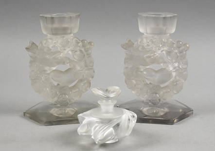 Vintage Lalique Mesanges & Samoa Frosted Crystal: Beautiful vintage Lalique art glass for use and display. This lot consists of the Samoa perfume bottle with original stopper and a pair of Mesanges love birds candle holders. Two measure approx. 6.5"