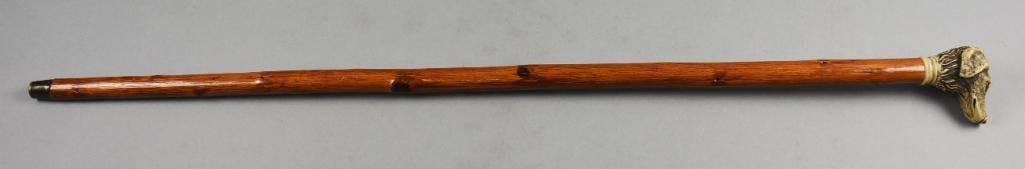 Vintage Carved Antler Dog Spaniel Walking Stick: Great piece in this vintage walking stick. Handle appears to be a spaniel carved in antler, shaft is solid wood with brass tip. No visible marks and measures approx. 26" long.