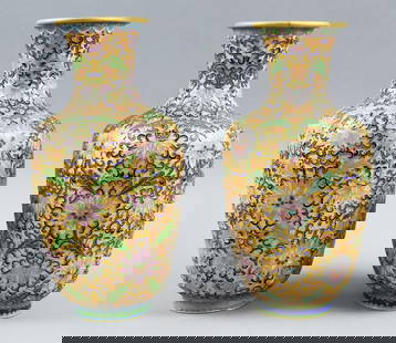 Vintage Chinese Yellow Cloisonne Vase Pair: Stunning vintage Chinese vase with floral motif. Wonderful cloisonne of lavender flowers with green leaves on yellow background all in a beaded metal trim that appears bronze. No visible marks in the