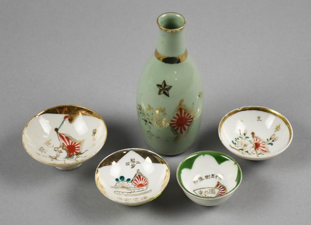 WWII Era Japanese Porcelain Military Infantry Bottle & Cups: Gorgeous porcelain from WWII. Japanese porcelain sake cups all hand painted with calligraphy, each with flag. Includes a celadon sake bottle also hand painted. Measure from?6" tall and cups are 2" to