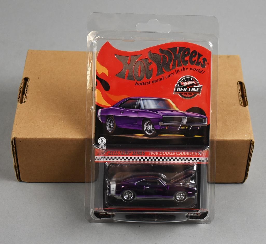 2021 Hot Wheels RLC 1969 Dodge Charger MOC NOS: The images show a 2021 Mattel Hot Wheels Red Line Club 1969 Dodge Charger R/T in purple Spectraflame paint with metallic silver Real Riders Turbine wheels. Part of the RLC series, this collectible fea