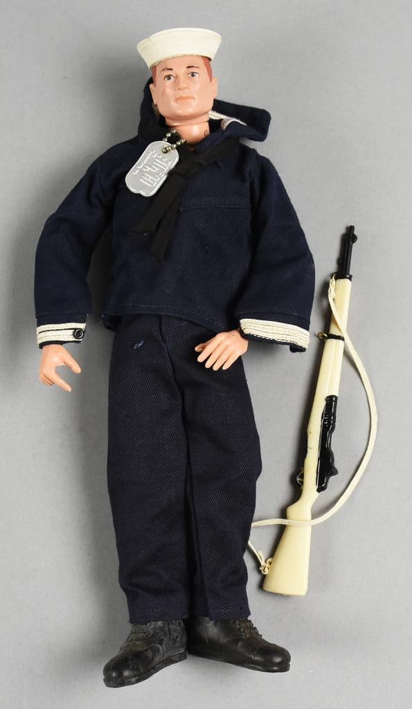 1966 Hasbro GI Joe Navy Shore Patrol in Uniform: Great looking Hasbro GI Joe Navy Shore Patrol action figure. He comes in Naval blue uniform with hat and boots. The rifle included appears to have come from the dress parade as a separate accessory fo