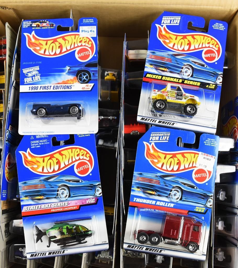 1990s Mattel Hot Wheels Factory Shipping Case-MOC-NOS: Lot is a 1990s Mattel Hot Wheels Factory Shipping Case-MOC-NOS. Factory case open, not all cars included, 70 in total. Single owner collection from the largest toy collector on the West Coast.